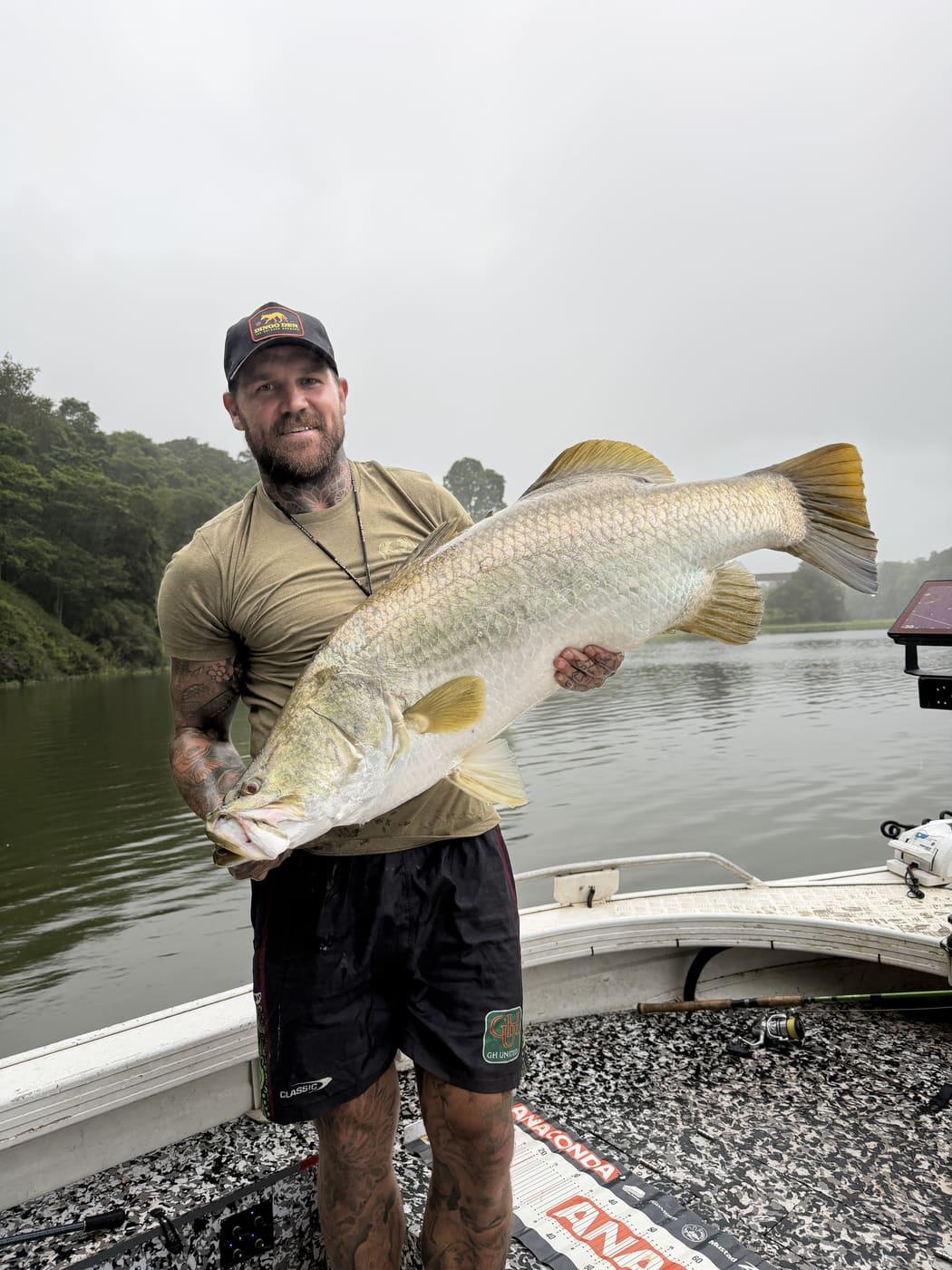 Josh Dugan on board with a barramundi catch